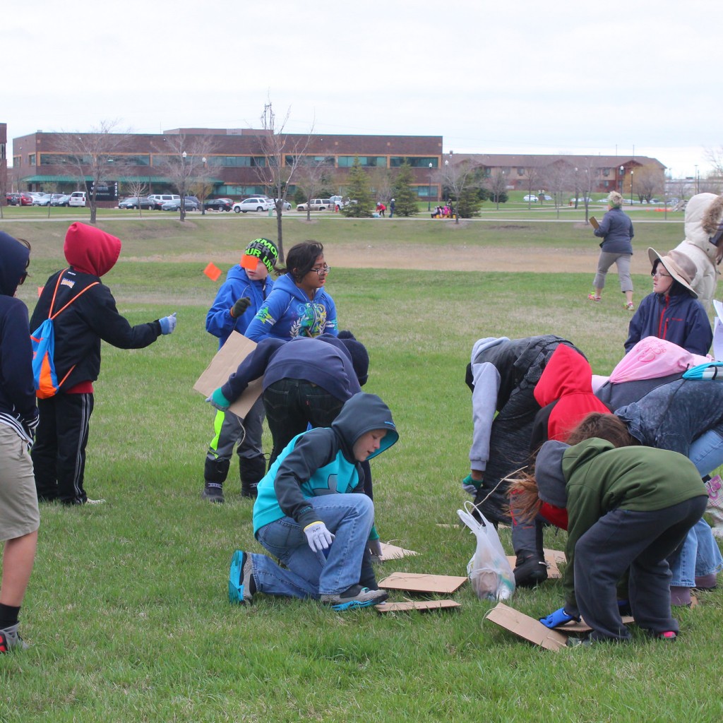 5th Grader inventory the site at World Garden Commons through a "square-foot" activity where the students learn about scale.